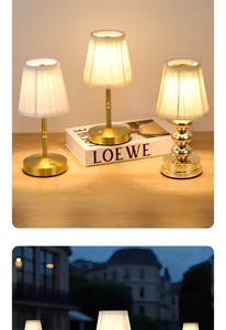 Golden metal rechargeable LED table lamps with pleated fabric shades for ambiance