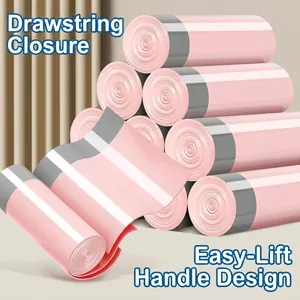 Durable pink drawstring garbage bags with portable handles for kitchen and home use