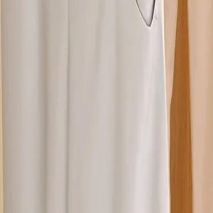 Close-up of white garment fabric texture held by a minimalist no-trace plastic pant clip