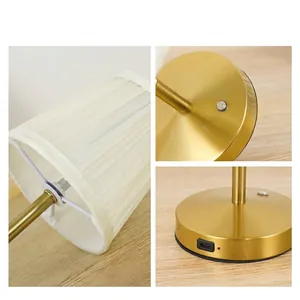 Modern gold metal LED desk lamp featuring pleated fabric shade and USB-C charging port