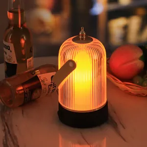 Modern rechargeable LED bar table lamp with warm glow in a cozy nightlife bar setting