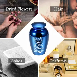 Small blue memorial cremation urn for pet or human ashes with heart engraving