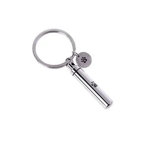 Silver stainless steel cylindrical pet cremation urn keychain with paw print pendant