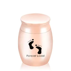 Small rose gold stainless steel pet cremation urn with Forever Loved footprint design