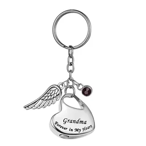 Llavero de urna de corazón de acero inoxidable con ala de ángel y grabado Grandma ceniza