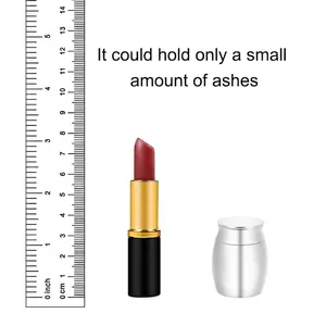 Mini silver stainless steel cremation urn for ashes shown with scale for size comparison