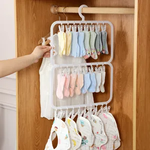 Multi-clip white plastic baby clothes hanger for socks and bibs in closet storage