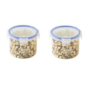 Two transparent plastic kitchen storage jars with blue lids for grains and food storage