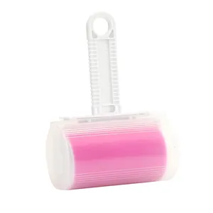 Washable reusable pink lint roller with white handle and protective cover