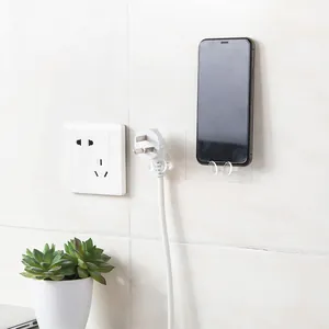 Transparente Klebehaken für Steckdosen und Wandhalterung für Mobiltelefone im Haus