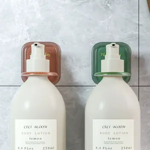 Pair of drill-free wall-mounted shower gel and shampoo bottle holders for bathroom organization