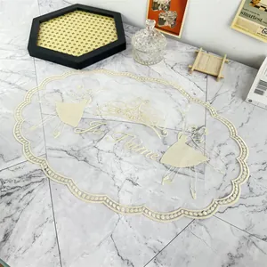 Detailed view of an elegant cream mesh placemat featuring ballerina embroidery