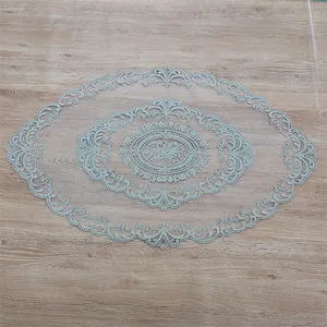 Detailed view of elegant oval French lace embroidery table runner with floral patterns