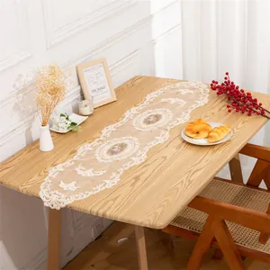 Macro detail of elegant European style lace table runner with intricate floral embroidery