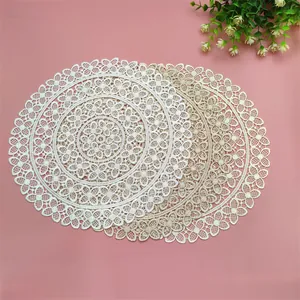 Detailed view of elegant circular lace woven placemats in white and beige colors