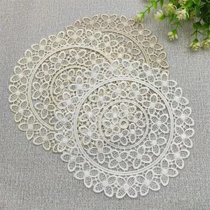 Elegant set of round floral lace placemats for vintage style dining table decoration
