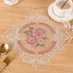 Exquisite embroidered rose lace placemat with hollow design shown on wooden table