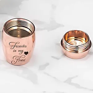 Detail view of rose gold mini urn with Forever in my Heart engraving and lid