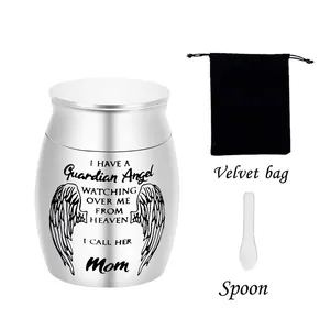 Silver memorial cremation urn with guardian angel engraving, velvet bag, and spoon