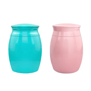 Miniature pet cremation urns in turquoise and soft pink glossy finish