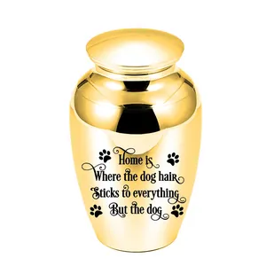 Polished gold pet cremation urn with 'dog hair' memorial quote and paw prints detail.