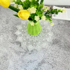 Detailed macro view of a white vintage French lace doily with elegant floral embroidery