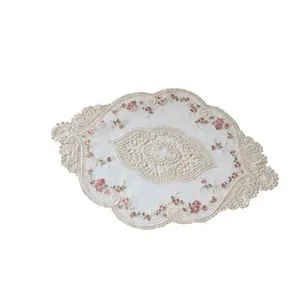 Elegant off-white lace mesh placemat with pink floral embroidery and scalloped edges