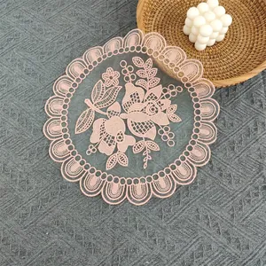 Detailed view of pink embroidered floral lace mesh placemat for vintage table decor