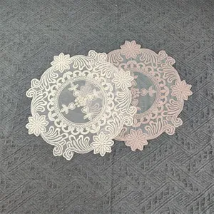 Elegant vintage round lace placemats featuring intricate floral embroidery and mesh detail