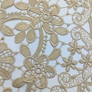 Detailed close-up showing the intricate floral lace embroidery of this beige table runner.