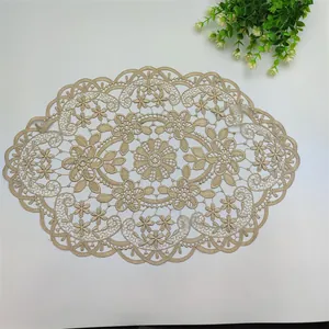 Detailed view of an intricate embroidered lace placemat with elegant floral pattern