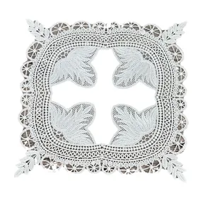 Vintage white lace placemat featuring intricate floral embroidery and openwork design