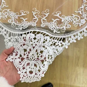 Exquisite white floral lace embroidered table runner featuring intricate hollow out patterns