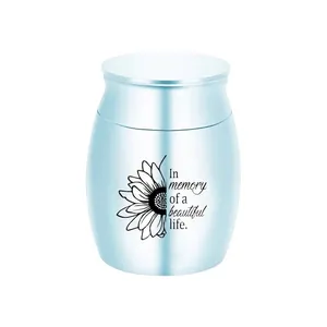 Elegant small light blue metal memorial cremation urn with sunflower and memorial quote