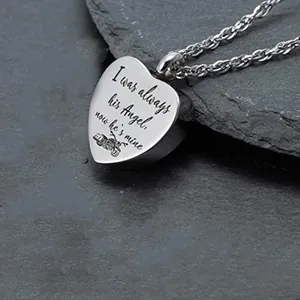 Stainless steel heart cremation necklace with memorial text and motorcycle engraving.