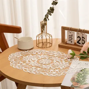 Elegant white oval lace placemat with floral embroidery for dining table decor