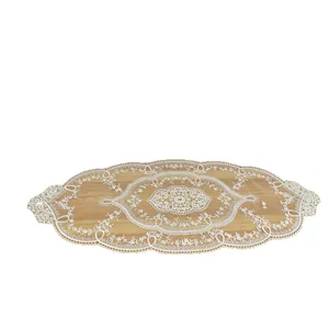 Elegant white lace embroidered oval table runner with intricate hollowed-out floral pattern