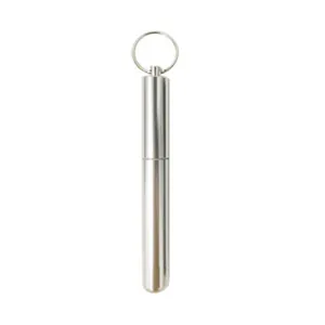 Close-up of portable stainless steel storage tube with keychain for straws or toothpicks