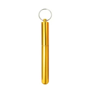 Detailed view of the gold aluminum alloy portable storage tube for straws or toothpicks.
