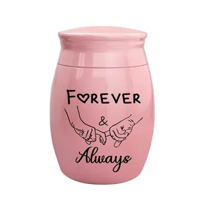 Close-up of pink ceramic cremation urn with Forever & Always engraving