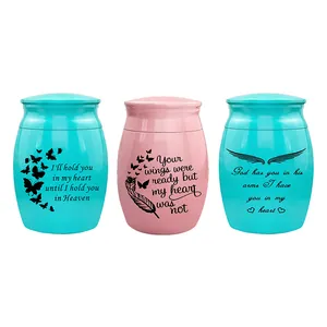 Small memorial cremation urns for human or pet ashes with engraved heartfelt quotes