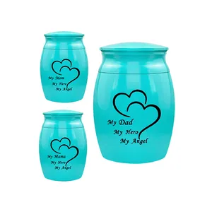 Turquoise keepsake memorial urns with engraved hearts and 'My Mom My Hero' text.