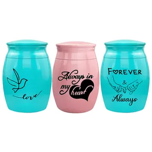 Small decorative cremation urns with commemorative English engravings for pets or family.