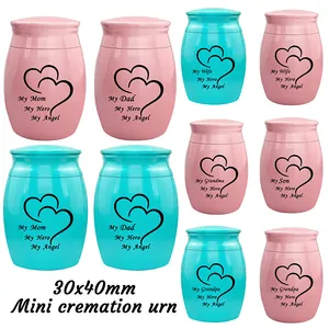Detailed view of 30x40mm mini cremation urns with heart and family tribute engravings