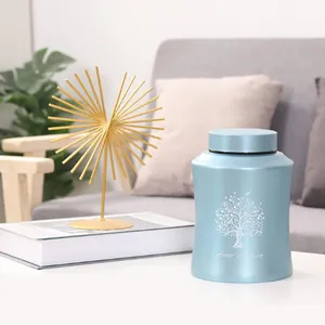 Blue tree of life cremation urn for human or pet ashes in living room setting