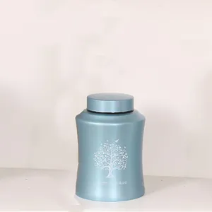 Light blue metallic cremation urn with Tree of Life laser engraving and memorial text