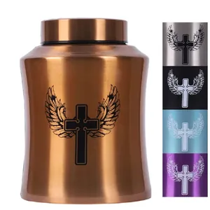 Close-up of engraved cross and wings on stainless steel pet cremation urns in various colors