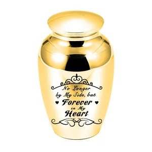 High-quality golden cremation urn detail showing sentimental heart engraving for ashes
