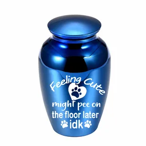 Detailed shot of blue metallic pet memorial urn featuring humorous engraved text