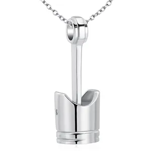 Detailed macro view of stainless steel engine piston pendant necklace for ashes memorial